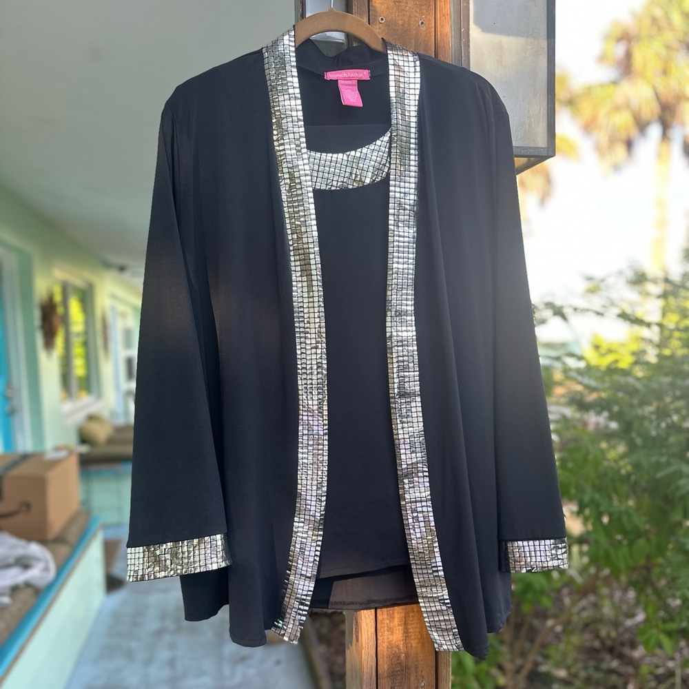 Woman Within Black Jacket, Top and pants with Silver Accents.